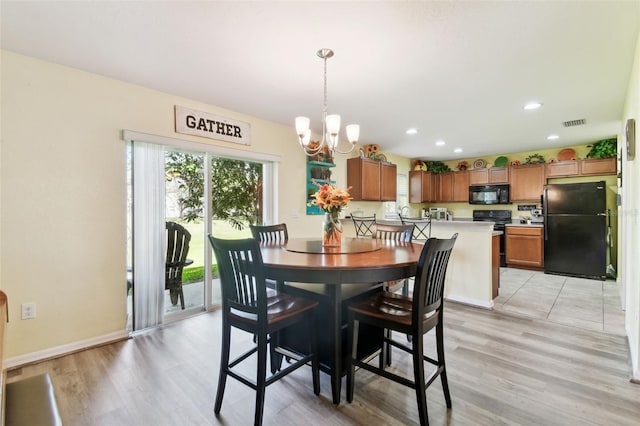 dining area with light wood-type flooring, visible vents, a notable chandelier, recessed lighting, and baseboards