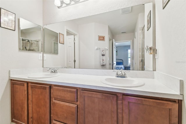 full bathroom featuring ensuite bath, double vanity, and a sink