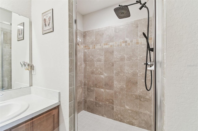 bathroom featuring a stall shower and vanity