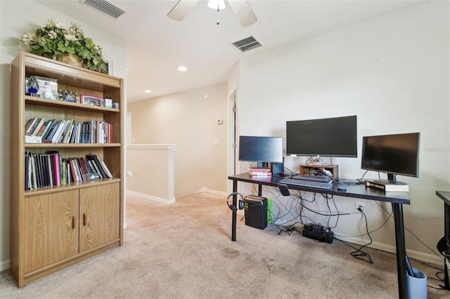 home office featuring ceiling fan, light colored carpet, visible vents, and baseboards