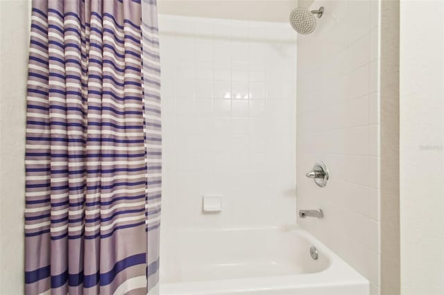 full bathroom with shower / tub combo