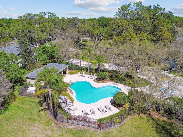 pool with fence, a lawn, and a patio area