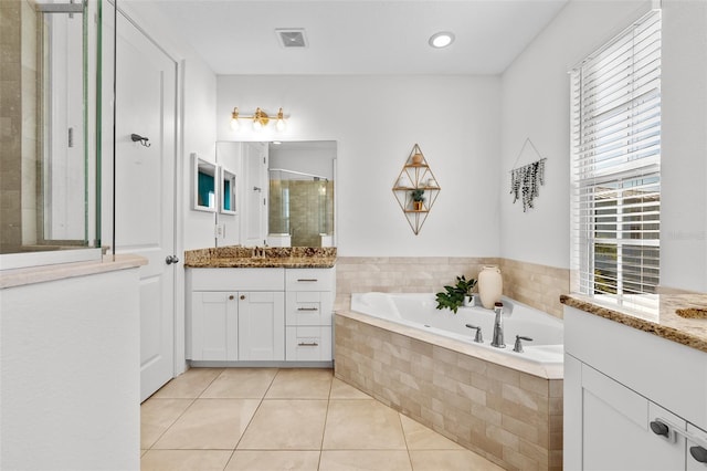 full bath featuring vanity, visible vents, tile patterned flooring, a shower stall, and a bath