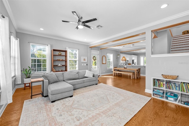 living room with ceiling fan, a healthy amount of sunlight, wood finished floors, and recessed lighting