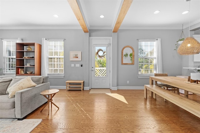 entryway featuring a wealth of natural light, baseboards, and light wood-style floors