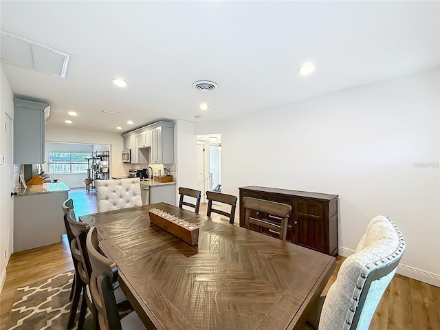 dining space featuring visible vents, recessed lighting, and light wood-type flooring