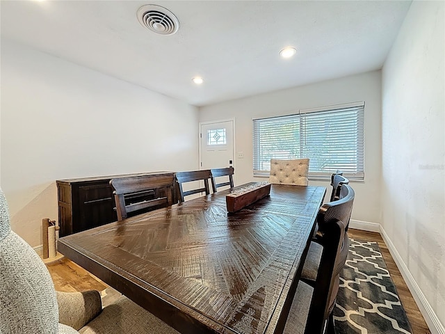 dining room with recessed lighting, visible vents, baseboards, and wood finished floors