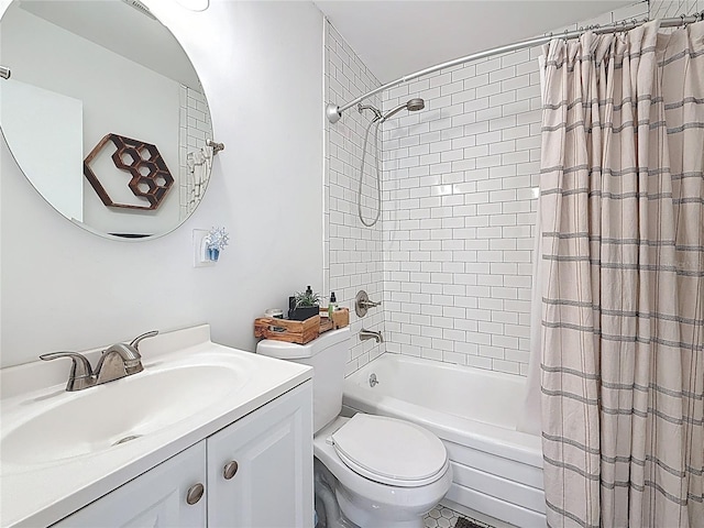 bathroom with vanity, toilet, and shower / tub combo