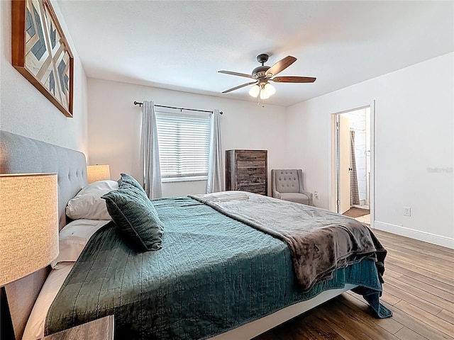 bedroom featuring a ceiling fan, baseboards, and wood finished floors