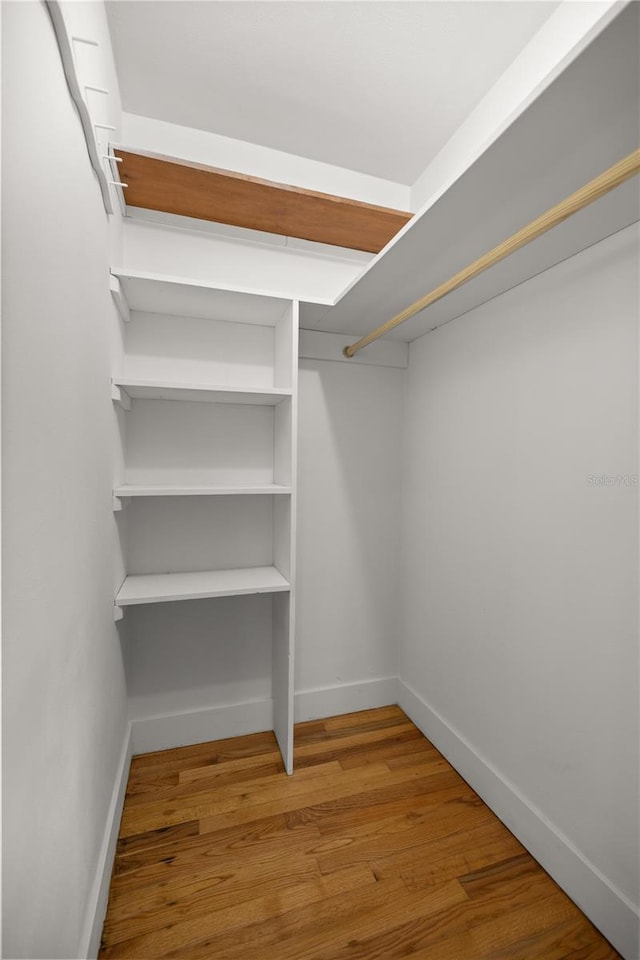 spacious closet with wood finished floors