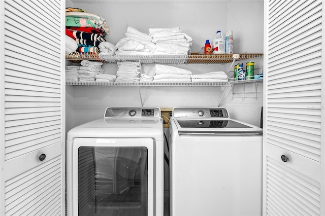 clothes washing area featuring laundry area and washing machine and dryer