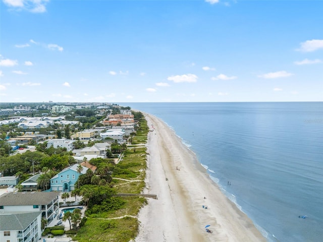 drone / aerial view featuring a beach view and a water view