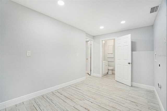 interior space featuring visible vents, recessed lighting, light wood-type flooring, and baseboards