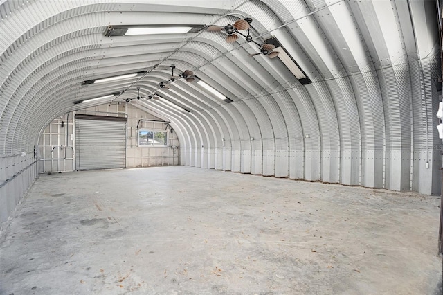 misc room featuring vaulted ceiling and unfinished concrete floors