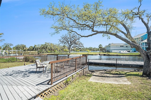 deck featuring a yard and a water view