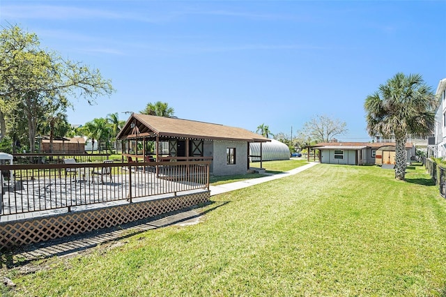 view of yard featuring a wooden deck