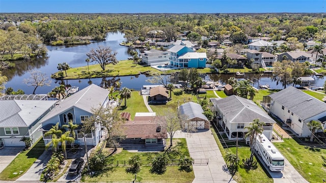 birds eye view of property with a residential view and a water view