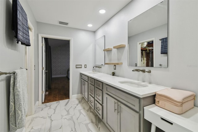 full bathroom featuring visible vents, double vanity, recessed lighting, a sink, and marble finish floor