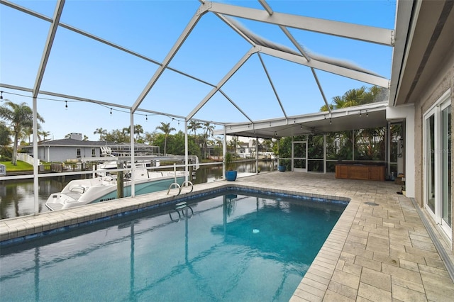 outdoor pool with a patio, a lanai, a dock, and a water view