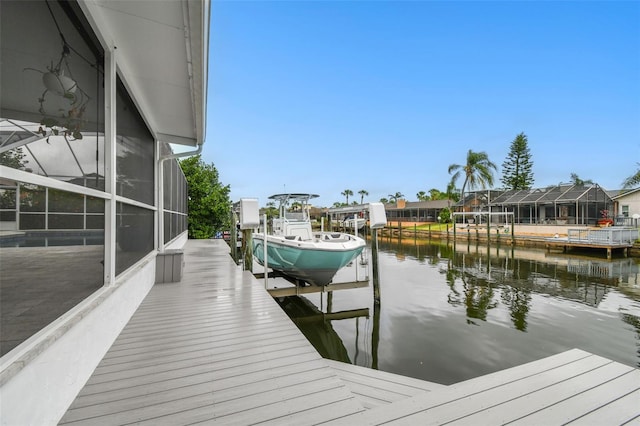 view of dock featuring a water view and boat lift