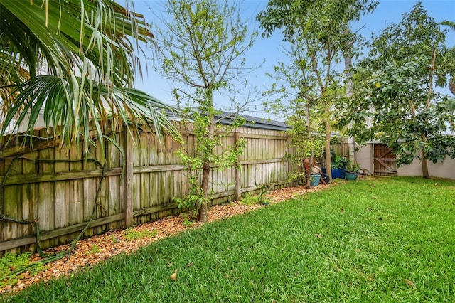 view of yard with a fenced backyard