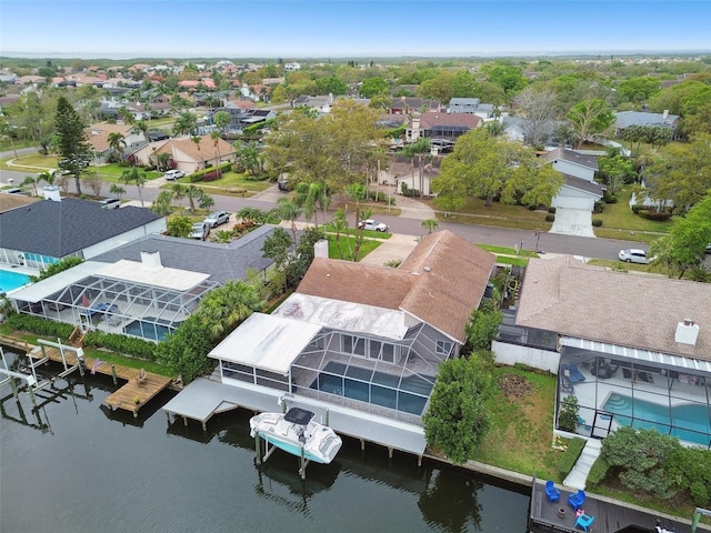 bird's eye view with a residential view and a water view