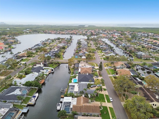 drone / aerial view with a residential view and a water view