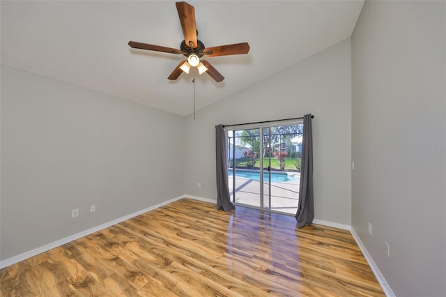 unfurnished room featuring ceiling fan, baseboards, lofted ceiling, and wood finished floors