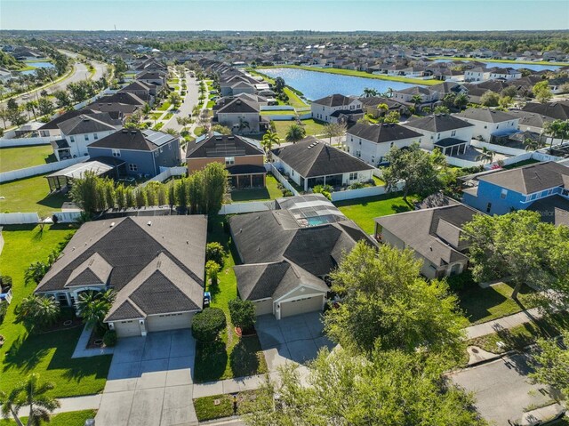 birds eye view of property featuring a residential view and a water view