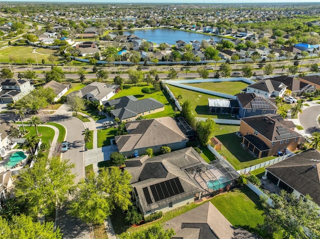 bird's eye view with a residential view and a water view