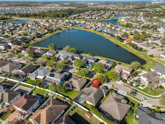 bird's eye view with a residential view and a water view