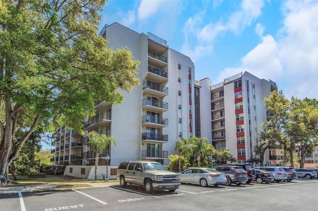 view of property featuring uncovered parking