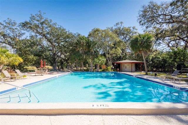 community pool with a patio area