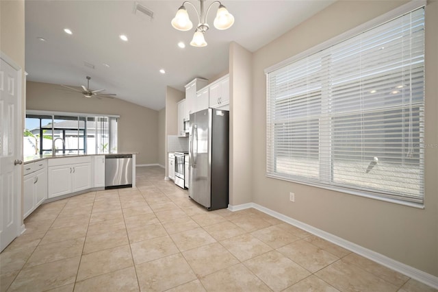 kitchen featuring stainless steel appliances, visible vents, light tile patterned flooring, and white cabinetry