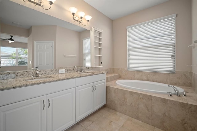 full bath featuring a bath, tile patterned flooring, double vanity, and a sink