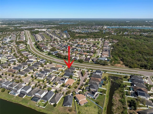 birds eye view of property with a residential view and a water view