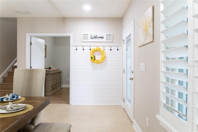 mudroom featuring light tile patterned floors and visible vents