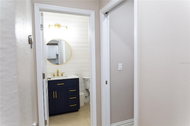 bathroom featuring tile patterned floors, toilet, and vanity