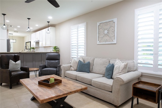 living room featuring recessed lighting, a ceiling fan, visible vents, and light tile patterned floors