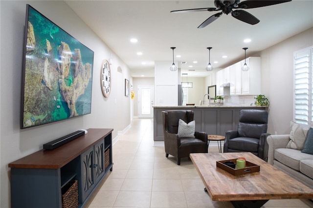 living area featuring a ceiling fan, light tile patterned floors, recessed lighting, and a healthy amount of sunlight