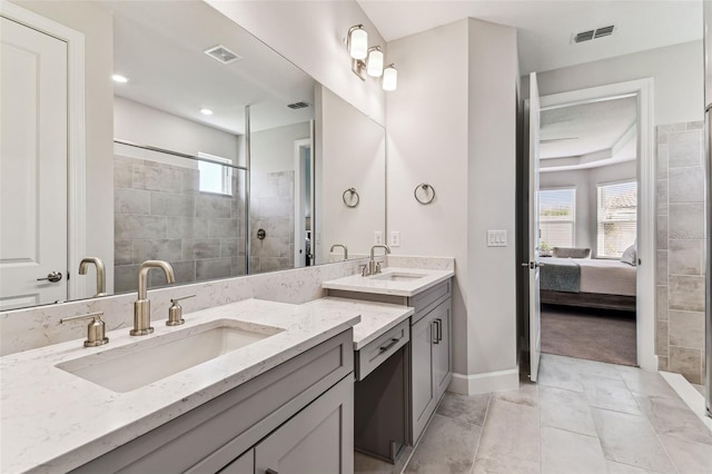 bathroom featuring plenty of natural light, visible vents, and a stall shower