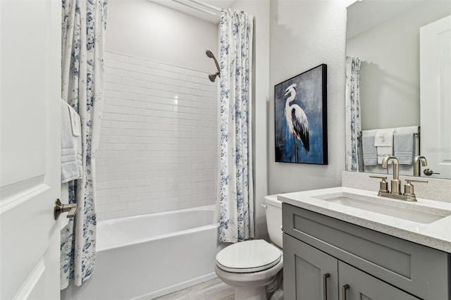 bathroom with toilet, shower / bath combo, and vanity