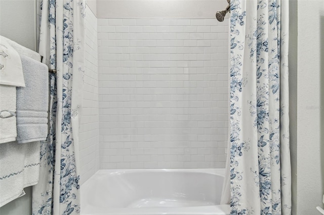 full bath featuring shower / bath combo with shower curtain