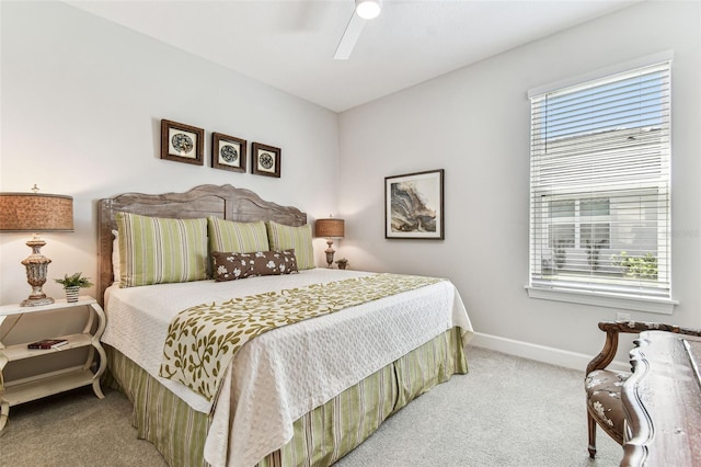 bedroom with carpet, baseboards, and ceiling fan