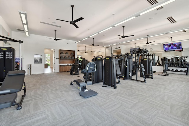 workout area with visible vents, carpet floors, and a ceiling fan