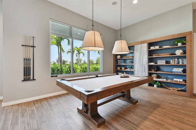 recreation room with billiards, baseboards, and wood finished floors