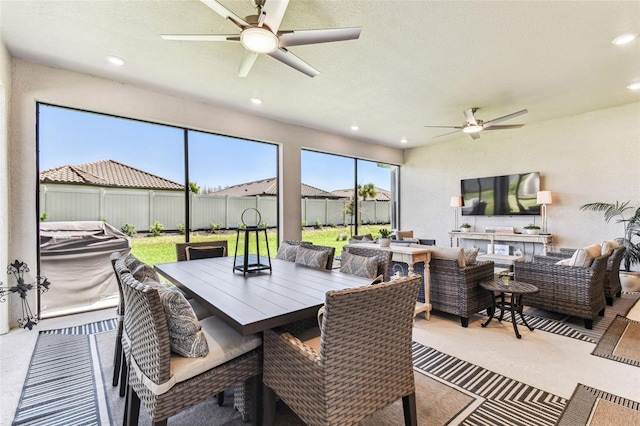 sunroom featuring a ceiling fan