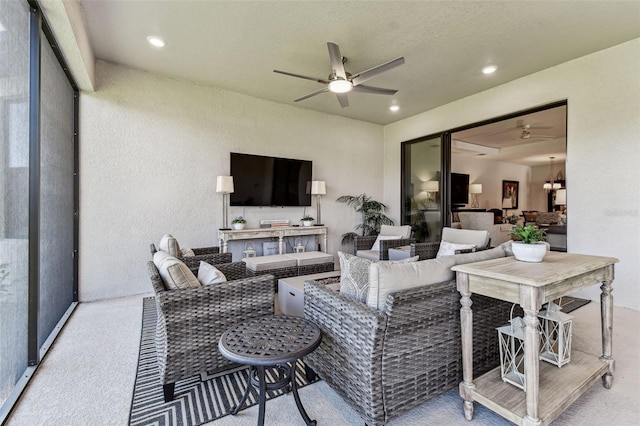 living area with recessed lighting, ceiling fan, and carpet flooring