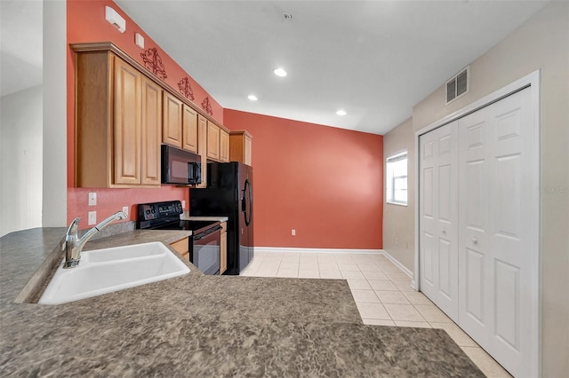 kitchen with visible vents, recessed lighting, light tile patterned flooring, black appliances, and a sink