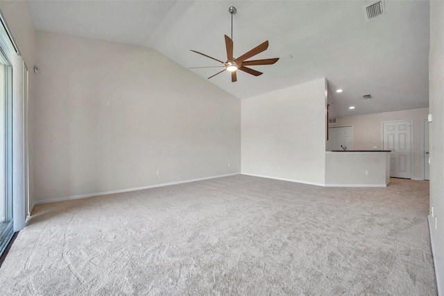 unfurnished living room with visible vents, a ceiling fan, carpet flooring, baseboards, and vaulted ceiling